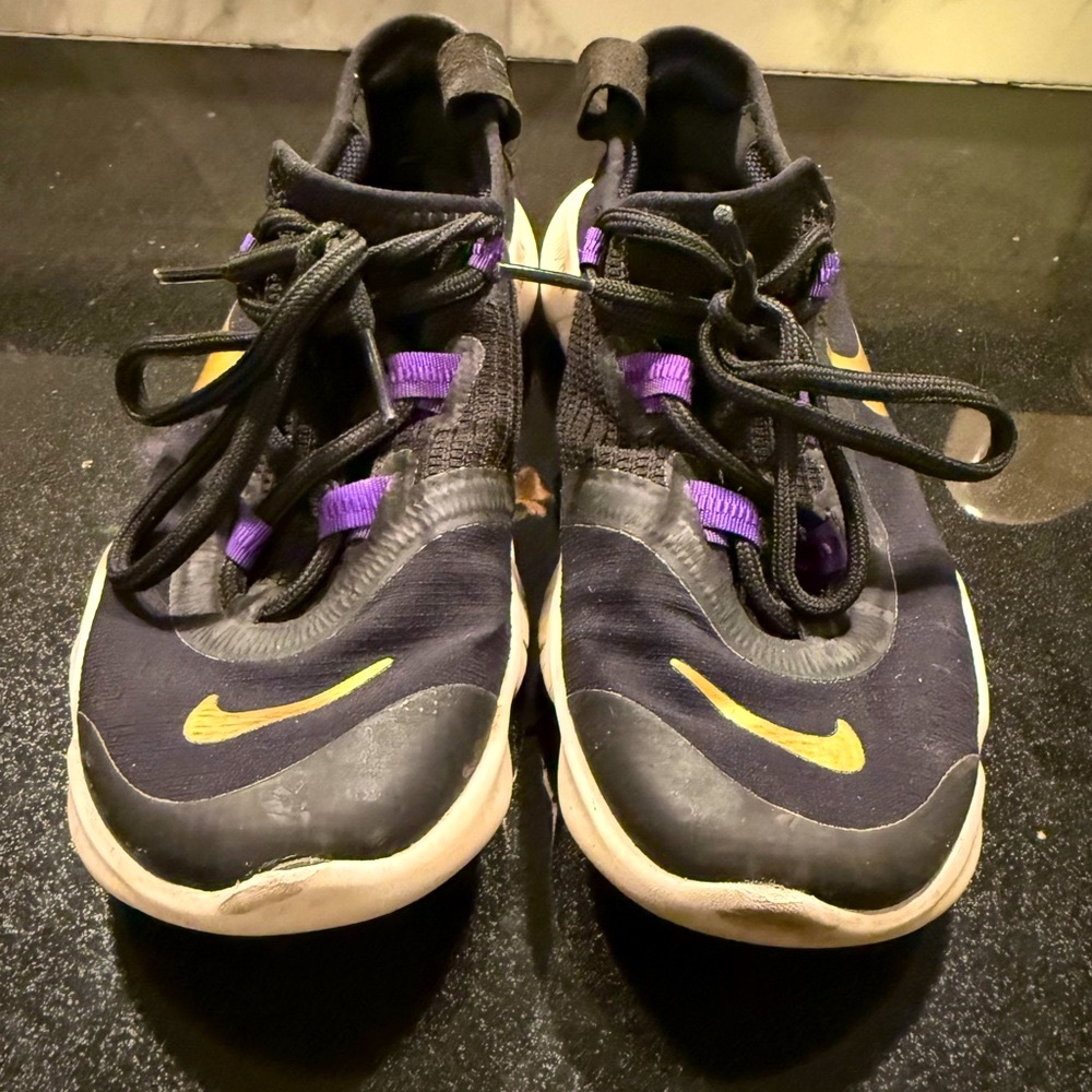 Nike Black and Purple Athletic Shoes with Gold Accents